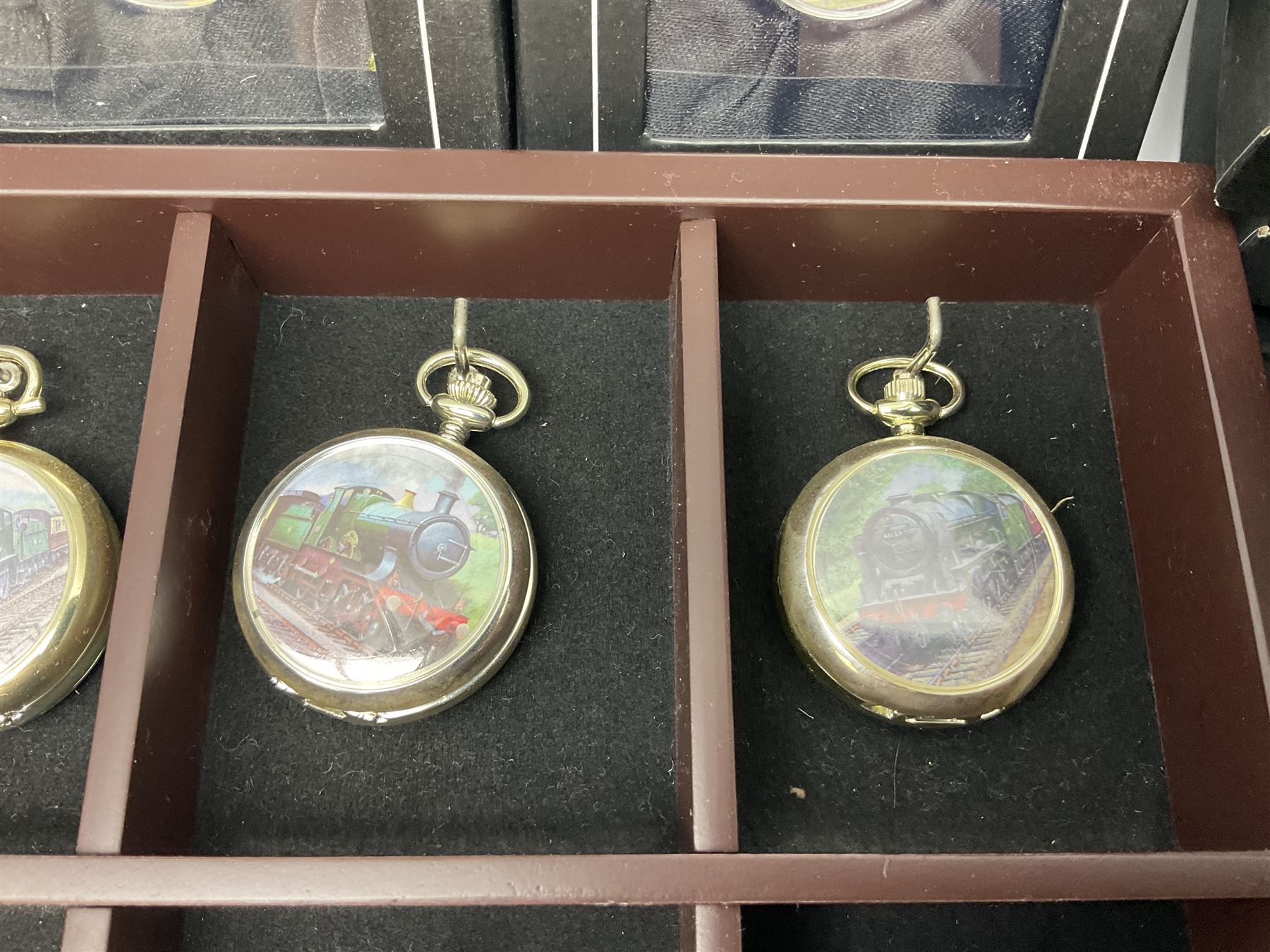 Twenty-three Glory of Steam Atlas Editions silver plated pocket watches, to include The Scottish Horse, Merchant Navy Class, etc, with wood display case, all boxed, twenty one with certificates