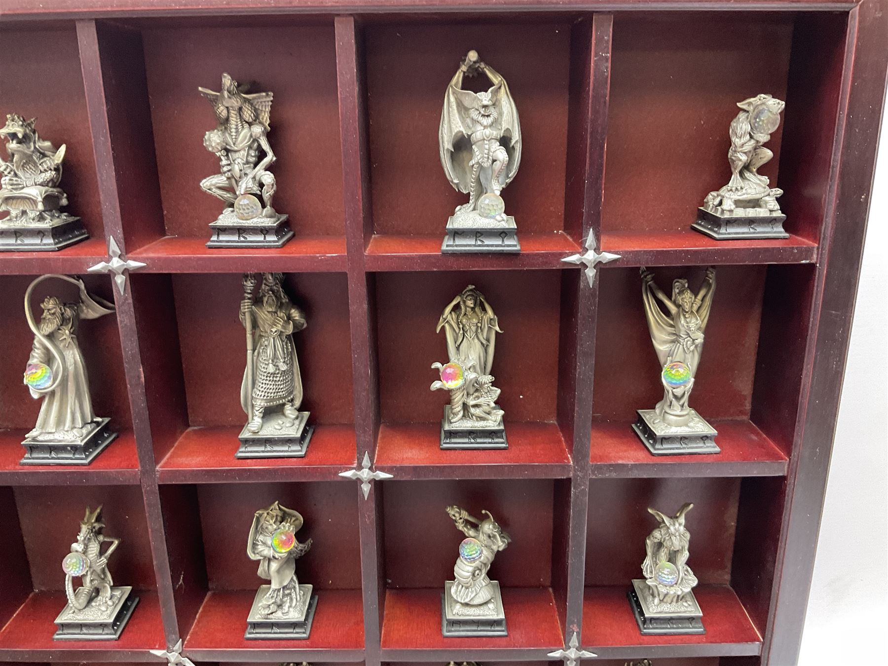 Danbury Mint 'The Fantasy of the Crystal' chess set consisting of mythical pewter chess pieces within a wooden case with chess board lid, together with 16 additional chess pieces in a wooden display case.