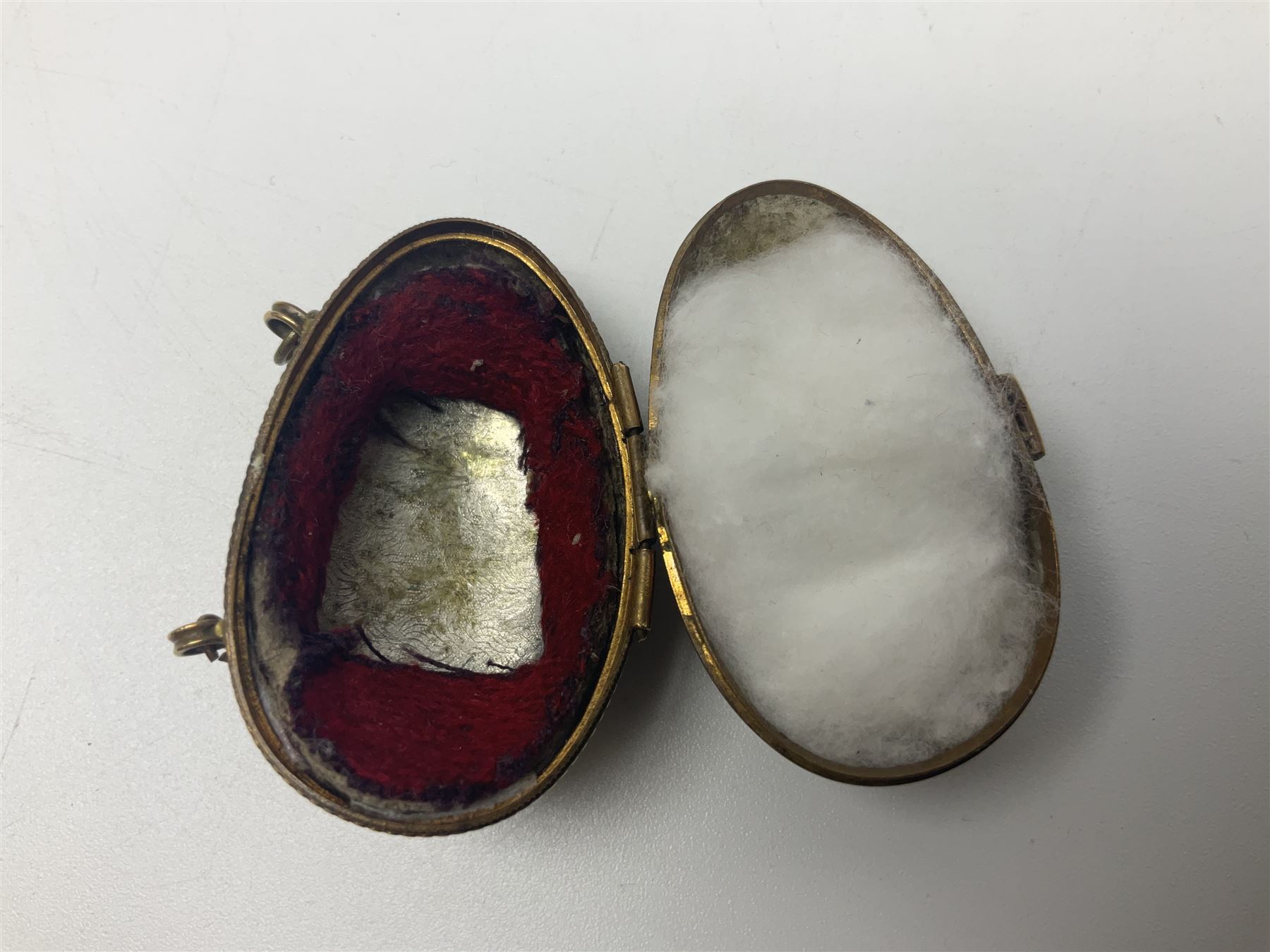 19th century lacquer thimble case with painted portrait of a woman to the hinged lid, together with two mother of pearl egg shaped thimble cases and one other