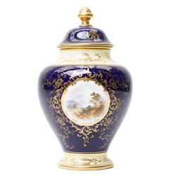 Coalport pot pourri jar and cover, circa 1920, the dark blue ground painted with landscape...