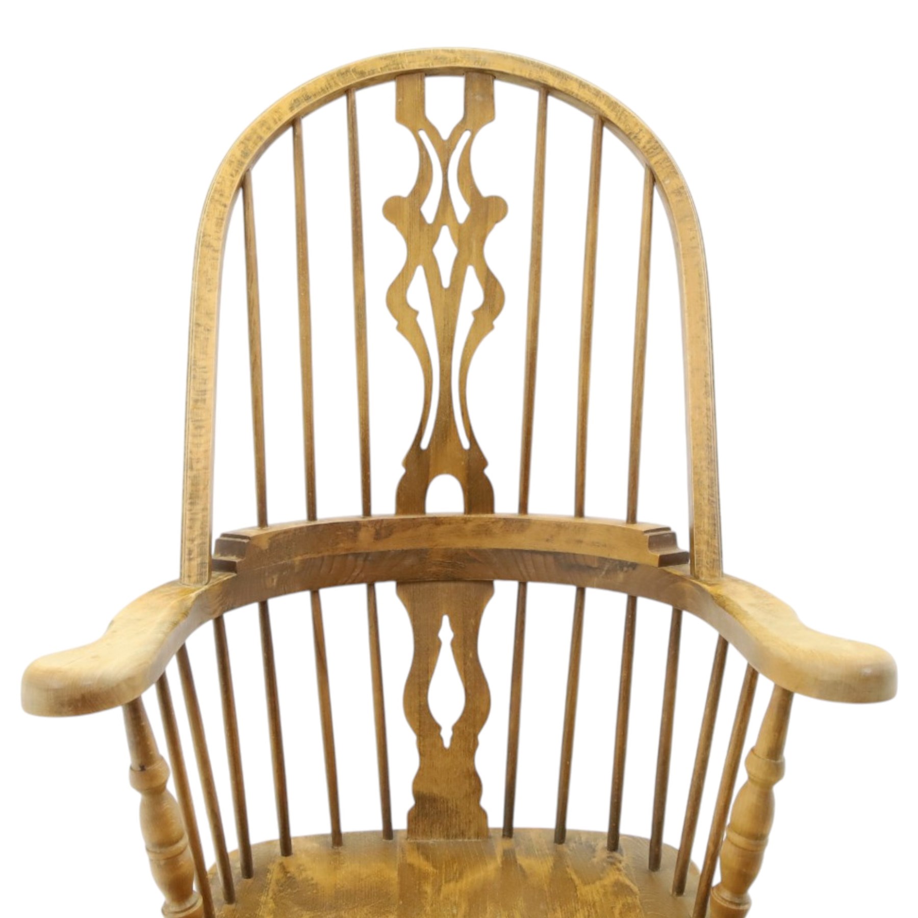 Traditional elm Windsor armchair, hooped spindle back with pierced splat, shaped elm seat, on turned supports united by double H stretcher, turned supports