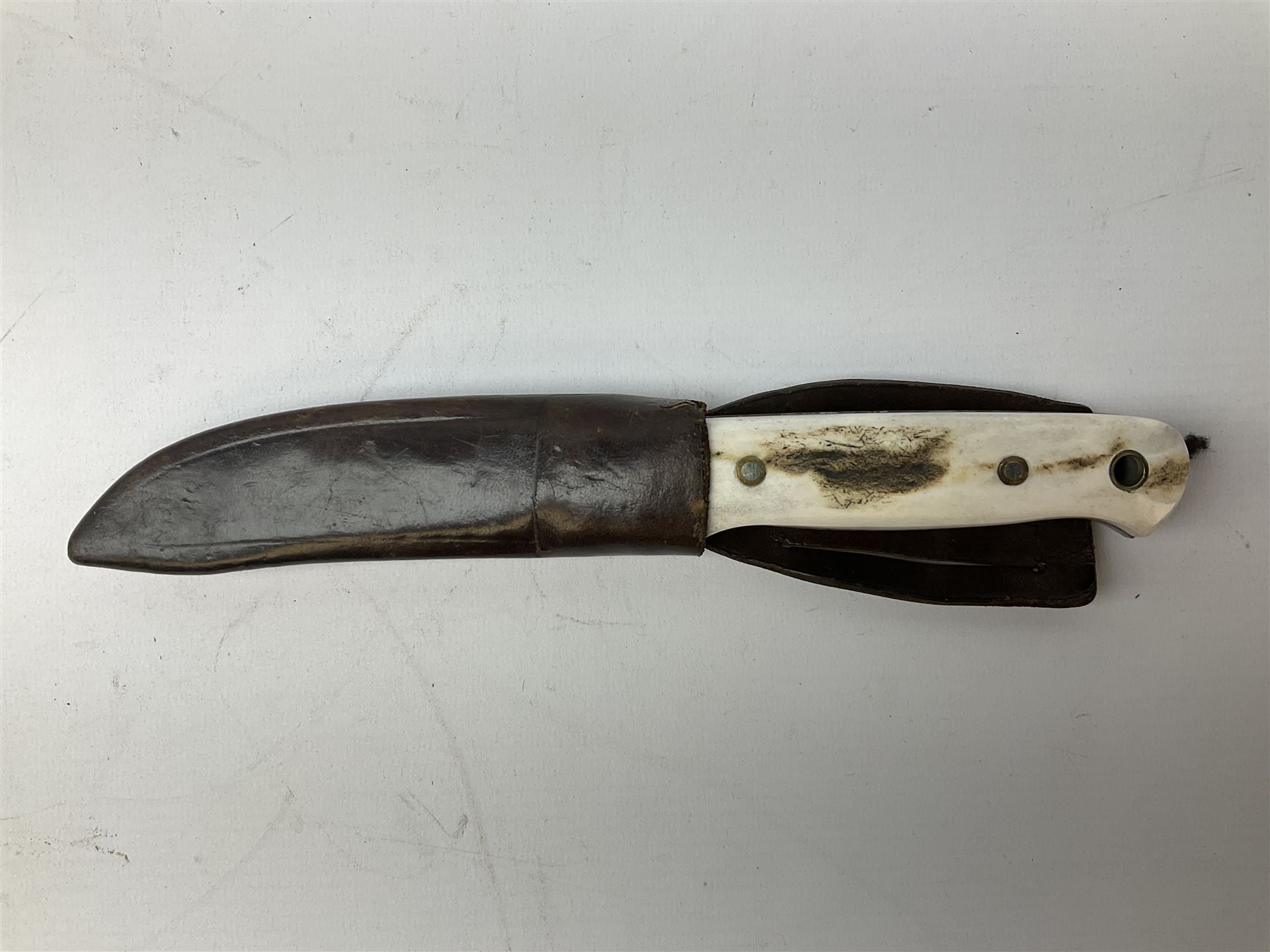 Three hunting knives, each blade marked A. Wright & Sons Sheffield, one with leather handle, one with horn handle and one with antler handle; each with leather sheath (3)