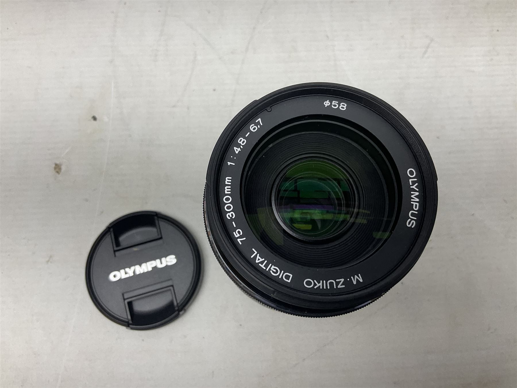 Olympus PEN-F camera body, with 'Olympus M- Zuiko Digital 25mm 1: 1.8' lens,  'Olympus M- Zuiko Digital 75-300mm 1: 4.8 - 6.7' lens and  'Olympus M- Zuiko Digital 17mm 1: 1.8' lens, with original box, together with Lowepro camera bag