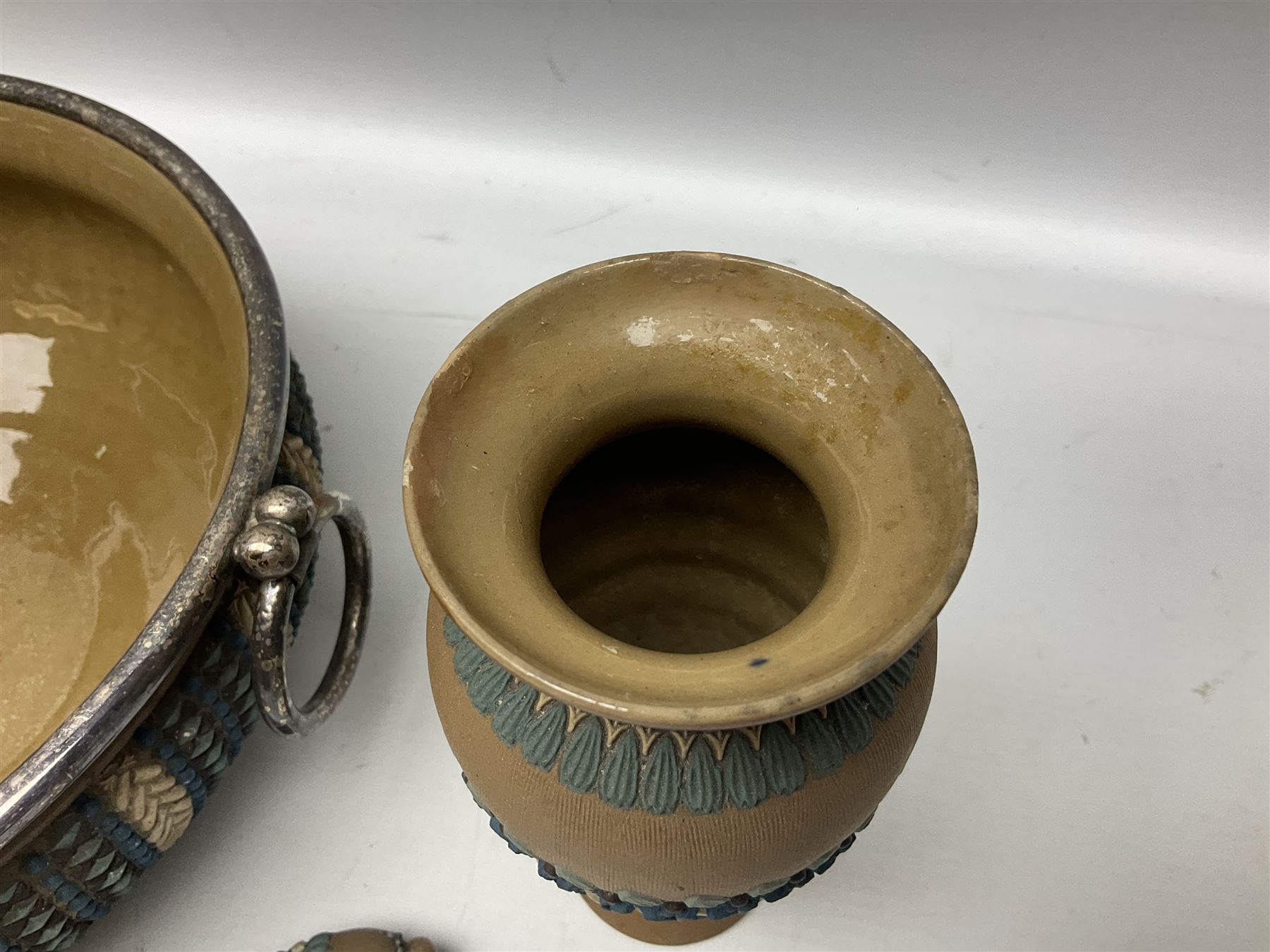 Five pieces of Doulton Lambeth silicon, comprising  salad bowl with plate mounted rim and handles, a pair of similar salad servers, vase and jug, jug H16cm