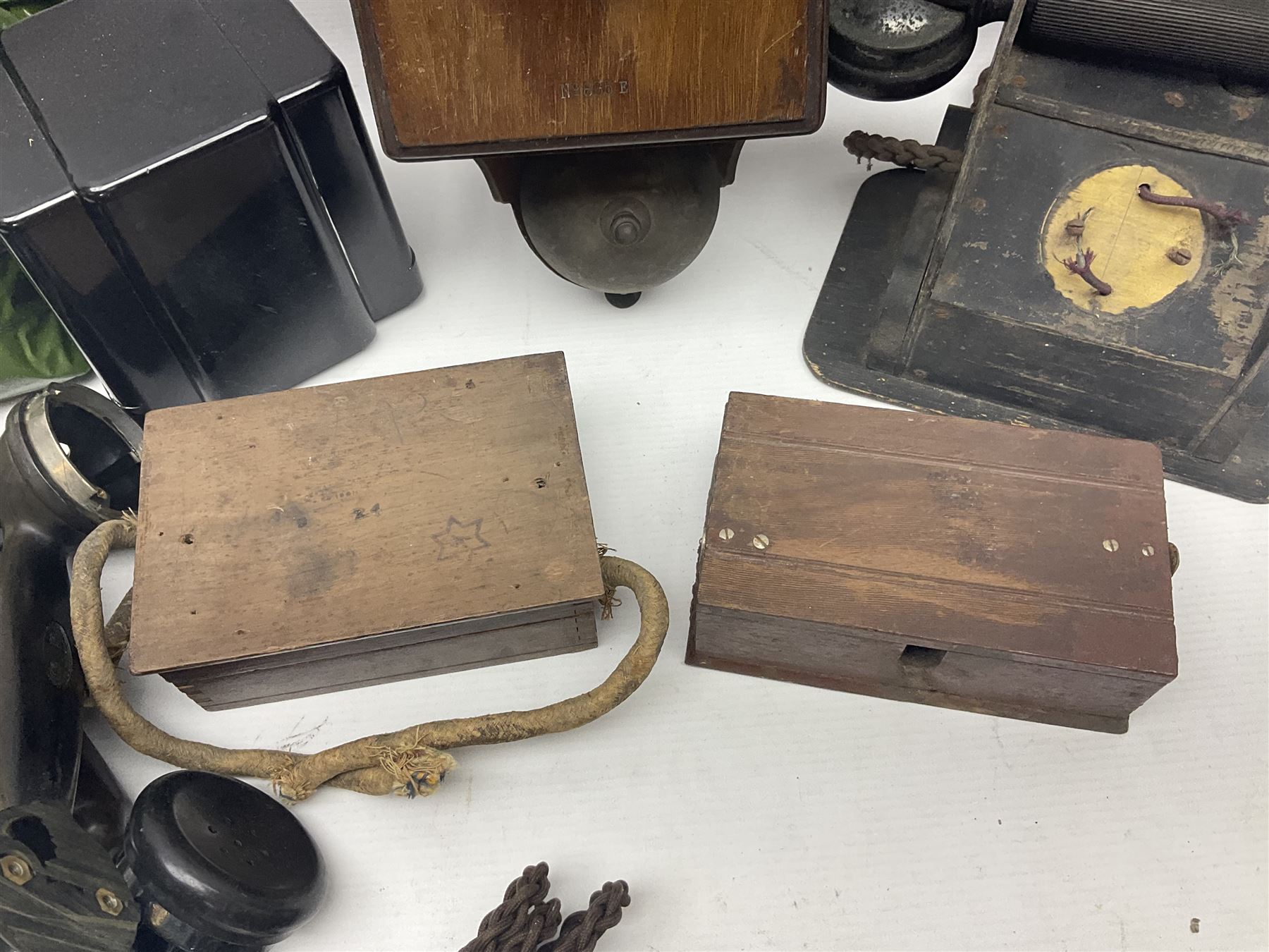 Collection of phone headsets, including GPO bakelite examples, together with other telephone parts 