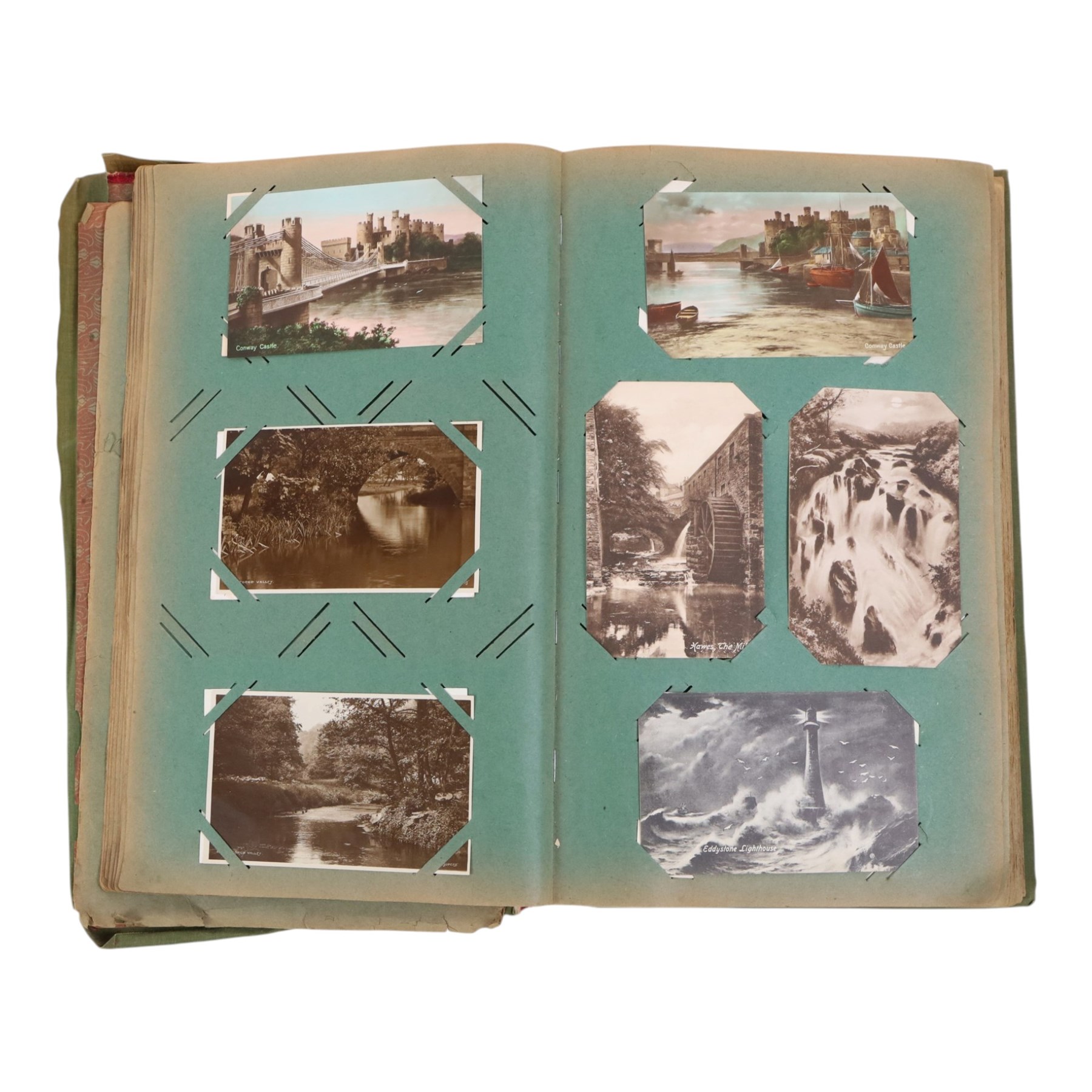 Collection of postcards in a album, together with an album of first day covers 