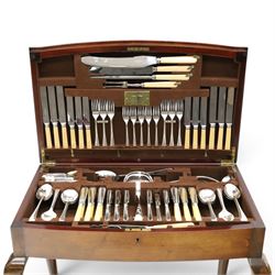Canteen of plated Elkington Monarchy cutlery in mahogany table stand on cabriole legs W67cm