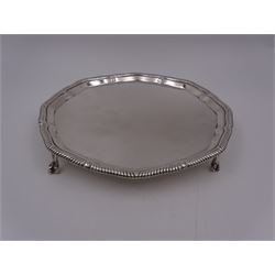 Early 20th century silver waiter, of hexagonal form, with oblique gadrooned rim, upon four ball and claw feet, hallmarked Goldsmiths & Silversmiths Co Ltd, London 1919, D21cm