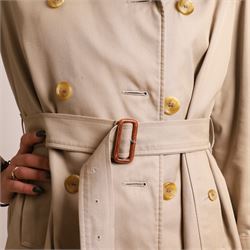 Burberrys - vintage beige cotton gabardine trench coat, double-breasted with button fastening, storm flaps, epaulettes, buckled cuff straps and detachable waist belt, lined in signature Nova Check, labelled Burberrys, Made in England, size M/L