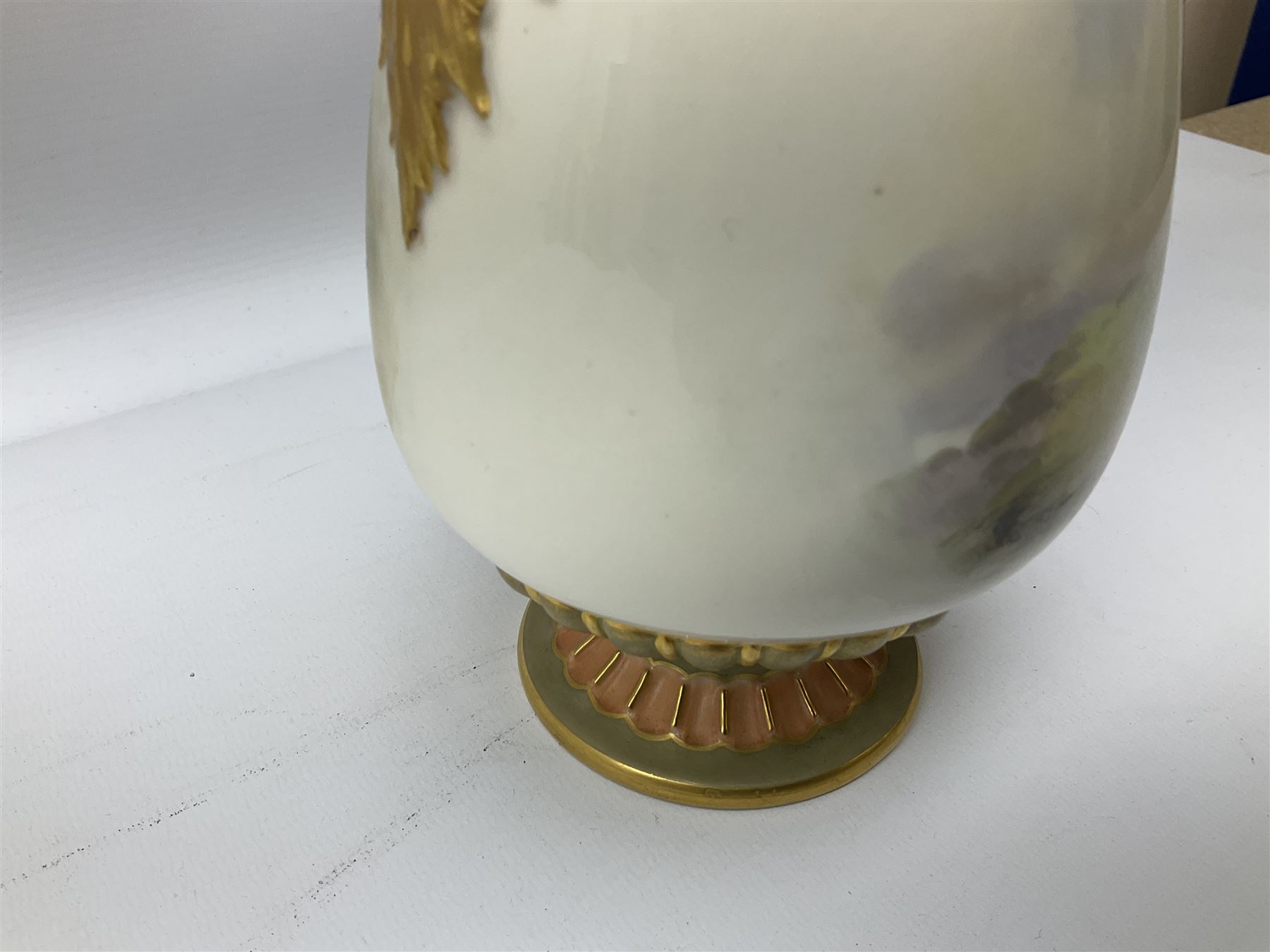 Early 20th century Royal Worcester vase decorated by Harry Davis, of ovoid form with twin acanthus mounted handles and waisted high neck supporting a domed cover, upon a circular foot, the body hand painted with sheep in a highland landscape, signed H Davis, with puce printed marks beneath including shape number 2425, and date code for 1907, H27.5cm