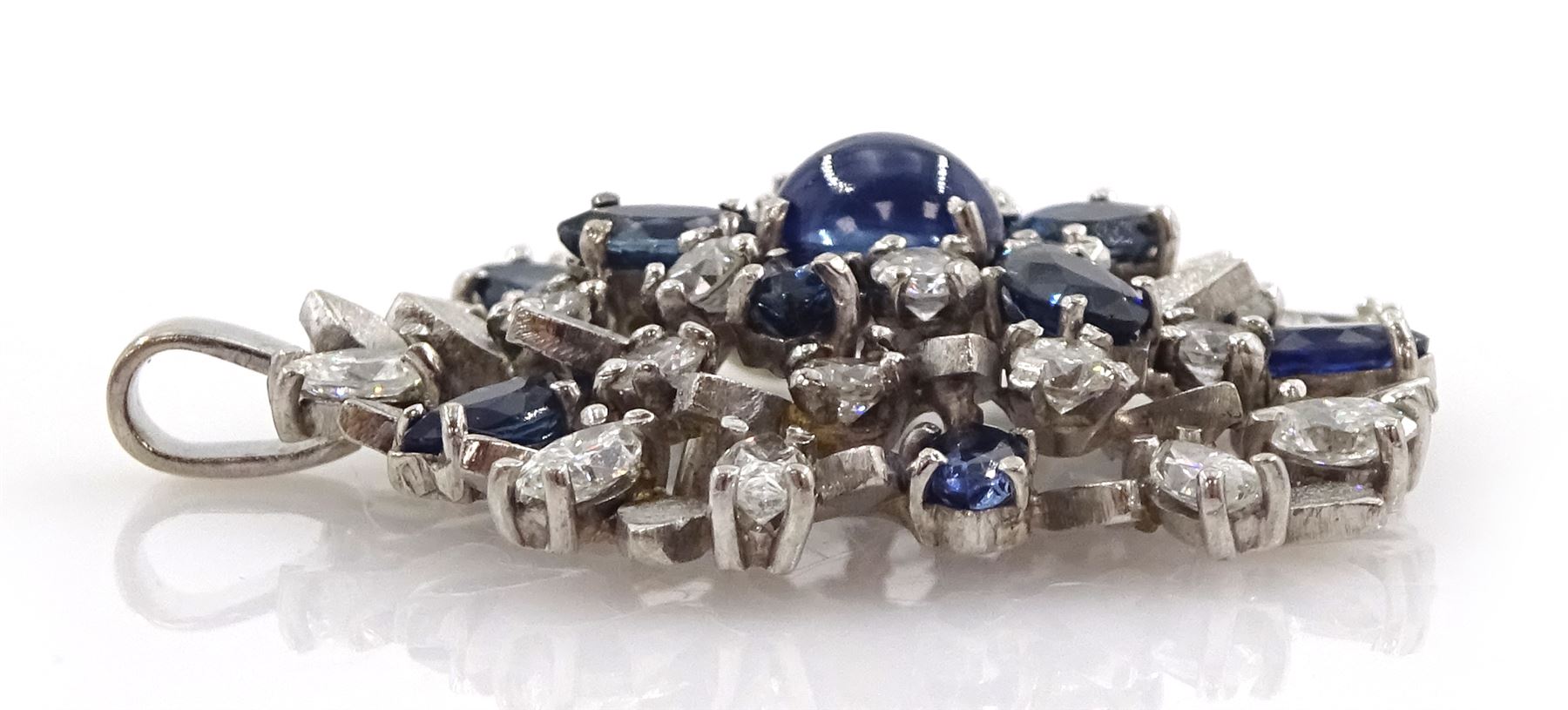 18ct white gold sapphire and diamond pendant, the central oval cabochon sapphire, with marquise cut sapphire and round brilliant cut diamond surround