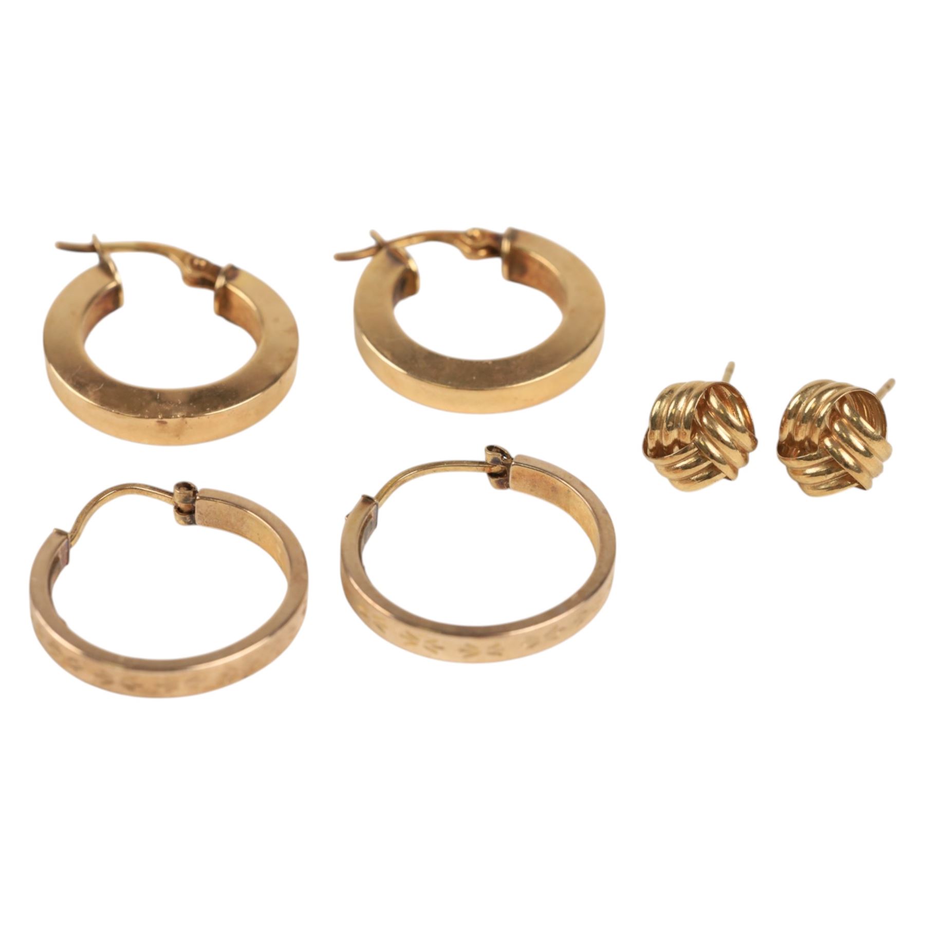Two pairs of 9ct gold hoop earrings and a pair of 9ct gold knot earrings