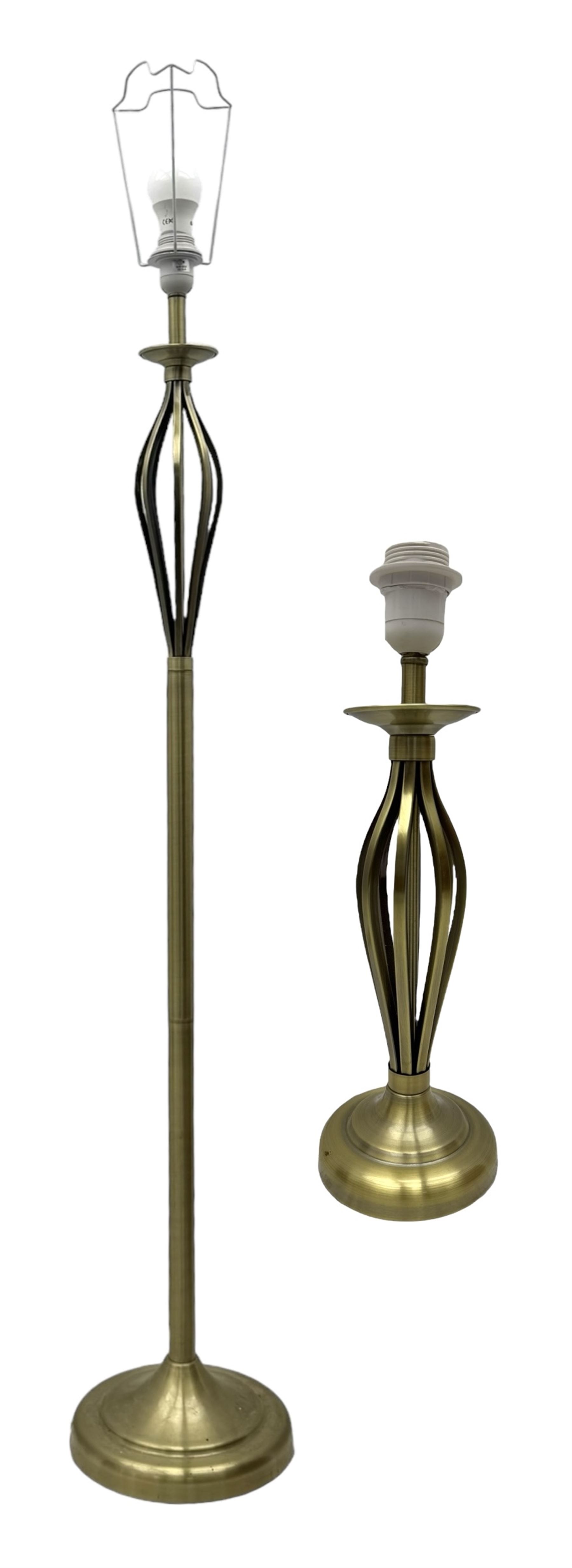 Contemporary brushed metal standard lamp, brass effect with cylindrical stem, on circular base, H131cm; matching table lamp, H35cm (2)