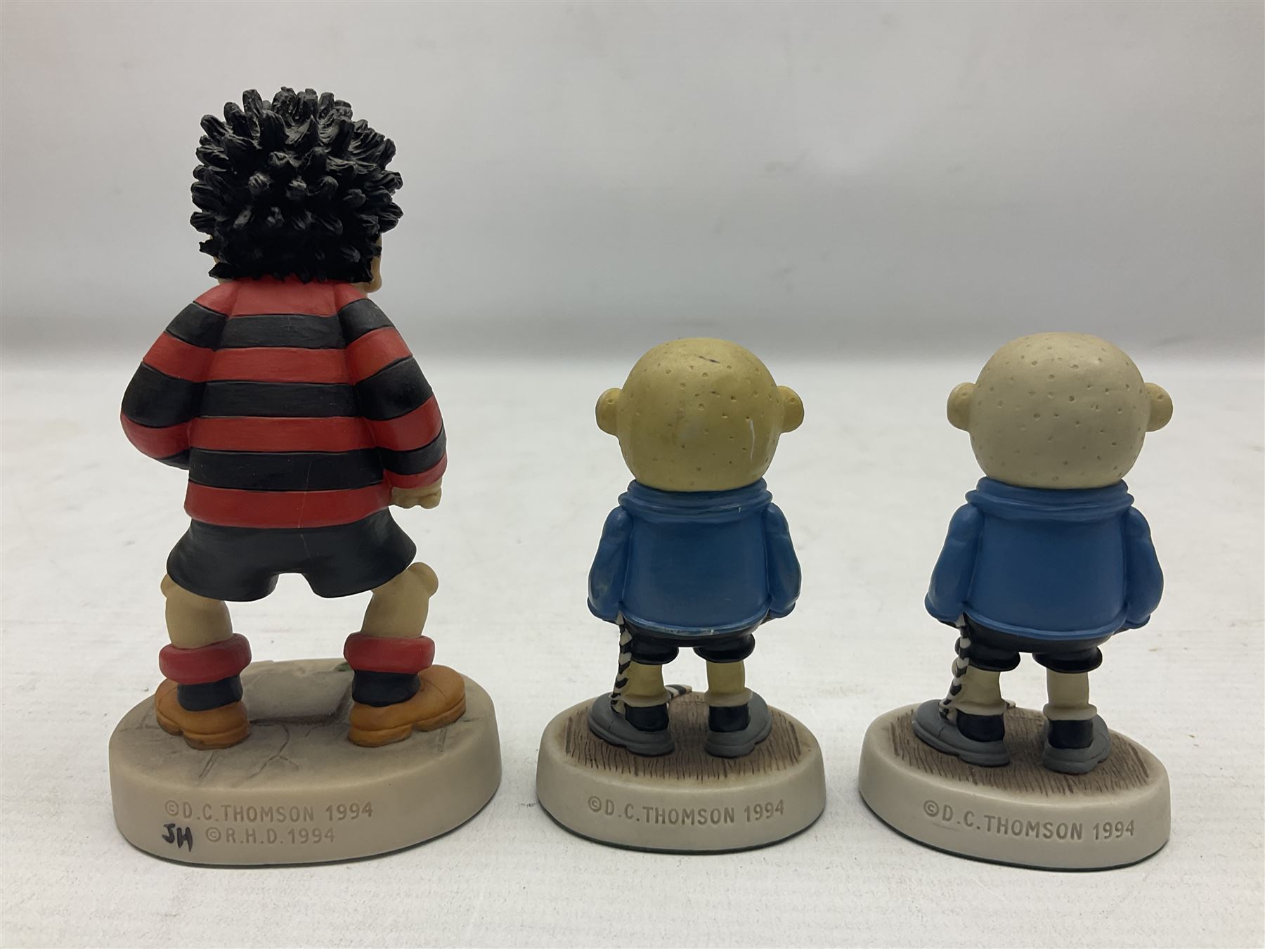 Eleven Robert Harrop figures from the Beano Dandy collection, comprising One Man & His Dawg BDS08, Picnic Desperate Dan BDS04, Fatty BD07, Desperate Dan BD03, Roger the Dodger BD20, Dennis the Menace BD01, Beryl the Peril BD05, Minnie the Minx BD04, Surfing BP03, two Spotty BD16, together with a Genuine Beano Ware lidded box (12)