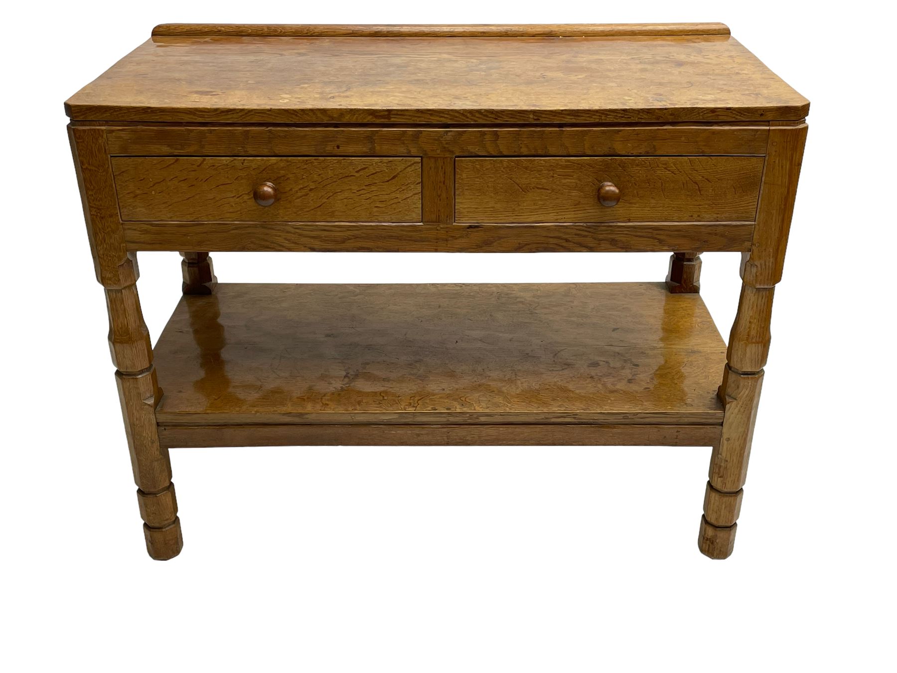 Mouseman - circa. 1950s oak serving table, adzed rectangular top over two drawers, on octagonal supports joined by adzed undertier, the rear right leg carved with mouse signature, by Robert Thompson of Kilburn