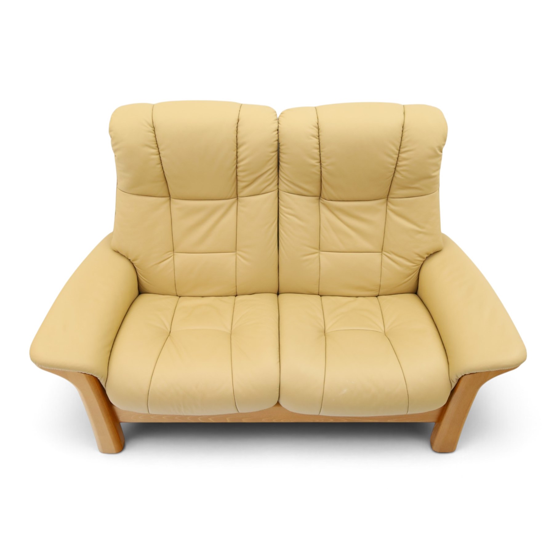 Ekornes Stressless - beech framed reclining two seater sofa, out-swept arms over tapering supports, upholstered in beige leather