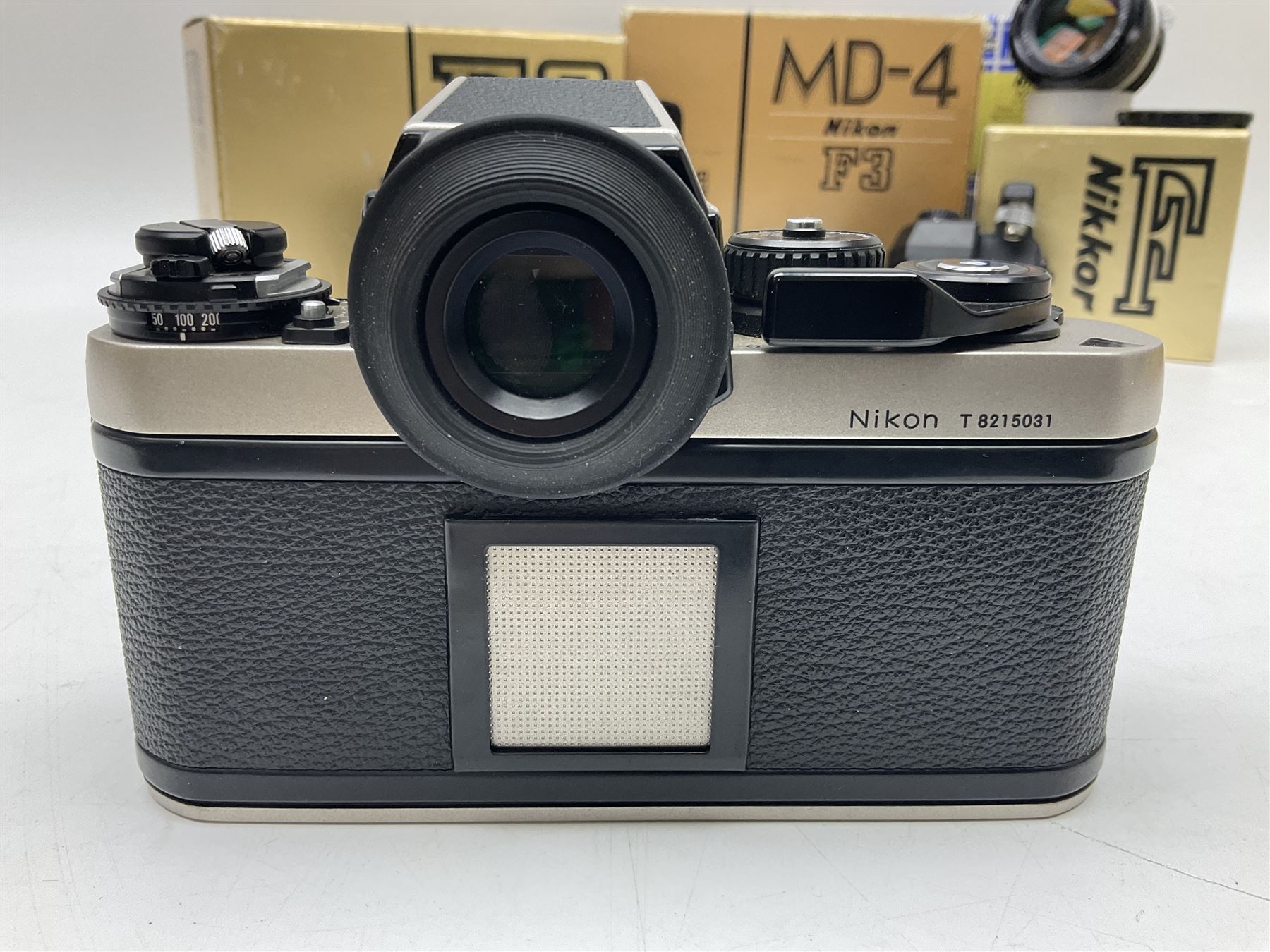 Nikon F3T camera body, in champagne/ titanium colourway, serial no. T8215031, with 'Nikon Nikkor 50mm 1:1.4' lens, Nikon MD4 motor drive, serial no. 156592 and Nikon MK-1 Firing range converter, all with original boxes 