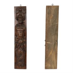 Pair of 17th century carved oak terms, each depicting a male figure in headpiece, with fish tail beneath fruits, 51.5cm