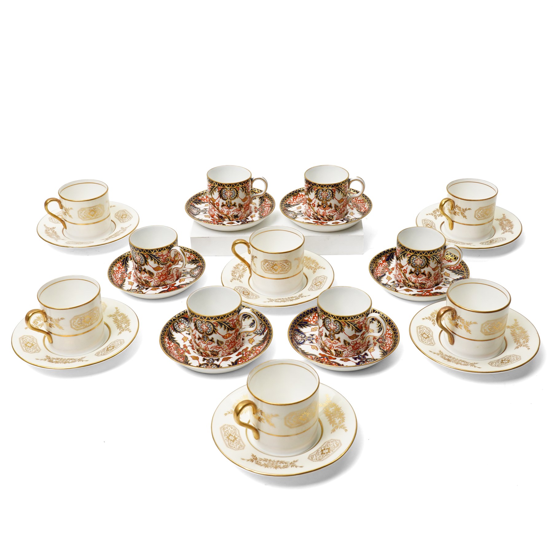 Six Royal Crown Derby coffee cans and saucers, pattern 383, together with six Aynsley coffee cans and saucers