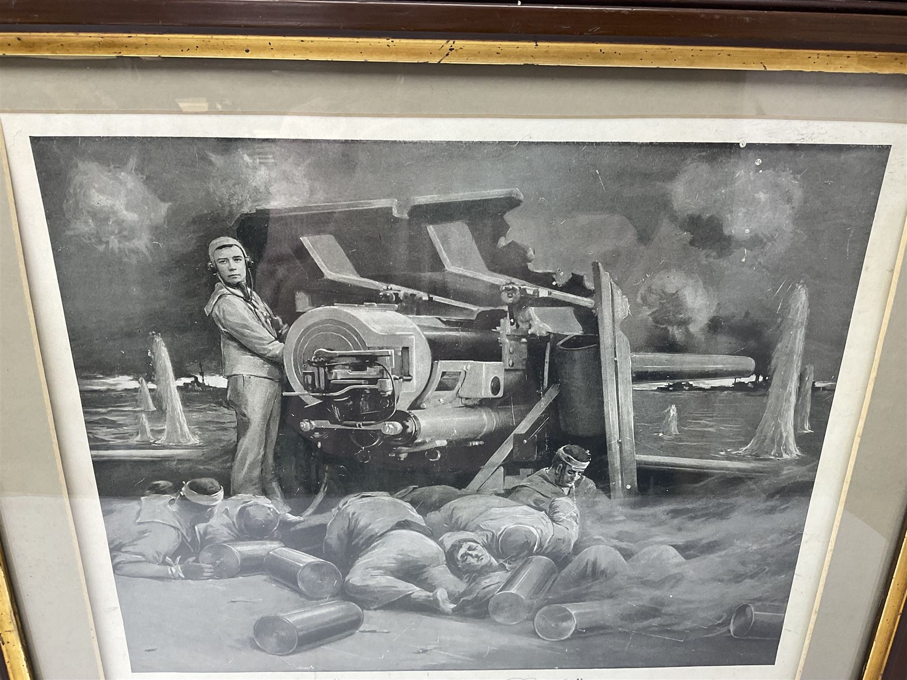 WW1 photogravure print depicting the VC action of Boy (1st Class) John Travers Cornwell mortally wounded in the Battle of Jutland May 31st 1916 34 x 41cm, walnut frame; and WW1 colour print entitled 'England's 1914-1919 Call' in simulated rosewood frame (2)