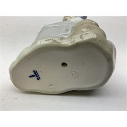 Four Lladro figures, comprising Afternoon Promenade no 7636, Nostalgia no 5071, both with original boxes, Girl with Lilies no 4972 and Madonna no 4534, largest example H27cm