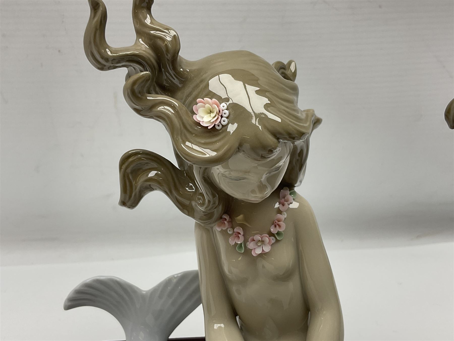 Lladro Mermaid trio set, comprising Illusion no. 1413, Fantasy no.1414 and Mirage no. 1415, all with wooden bases, largest H20cm