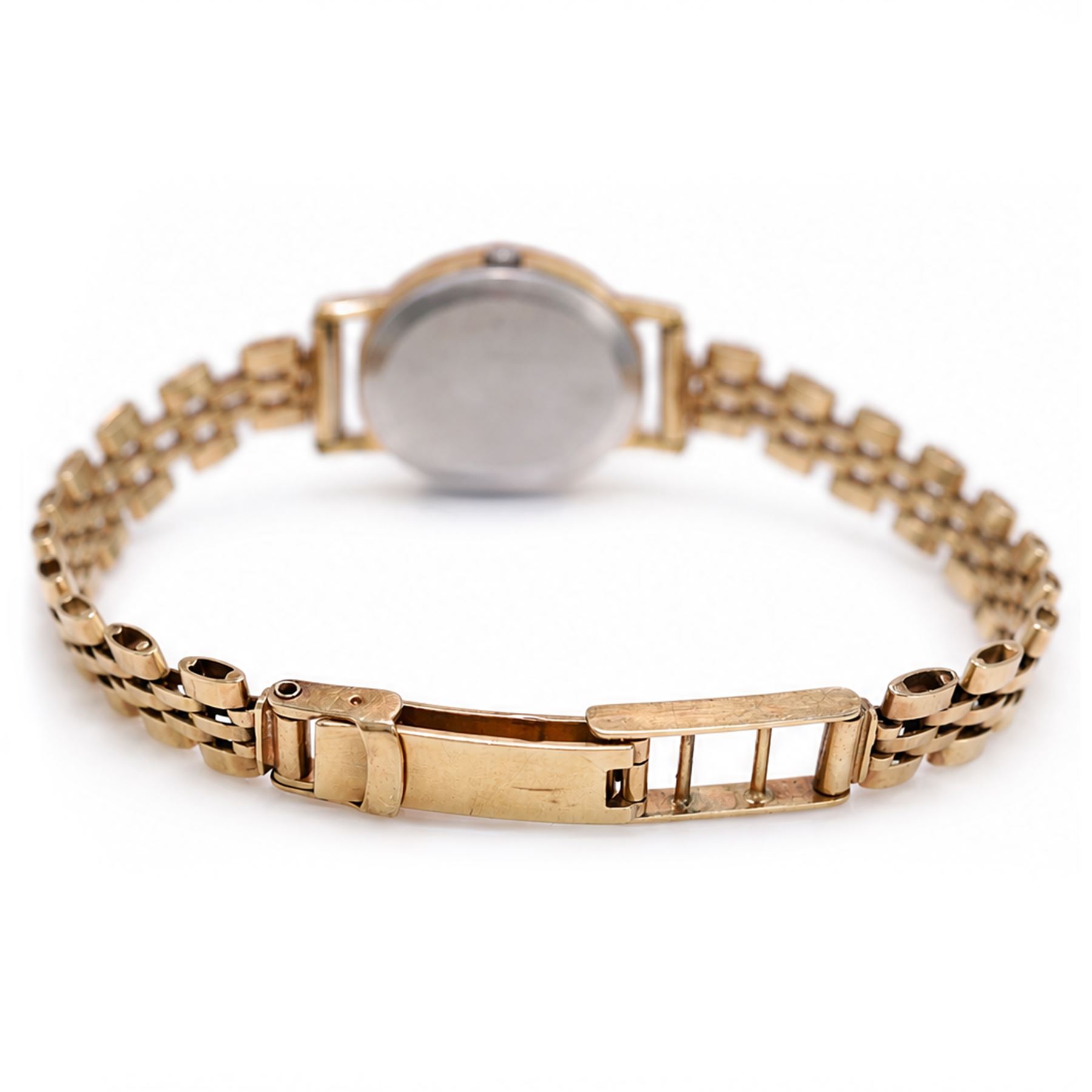 Omega ladies gold-plated quartz wristwatch, gilt dial with baton hour markers, on 9ct gold bracelet, Birmingham 1977, boxed with original leather strap
