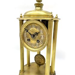 French gilt brass rotunda mantle clock under the original glass dome c1890, Parisian 8-day countwheel striking movement raised on six reeded brass pillars with a domed canopy and finial, 9-1/4” base with applied repoussé detail and polished gilt bands, 3-1/2” gilt dial with a decorative embossed centre, impressed circular Arabic numerals on a silvered background, pierced steel hands with an egg and dart chased bezel, striking the hours and half hours on a silvered bell, with the original conforming pendulum.


