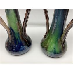 Pair of Art Nouveau style vases, probably Belgian, each with merging blue, brown and green decoration and three handles, impressed LSV beneath, H32cm
