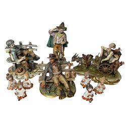  Group of Capodimonte figures, to include musical organ grinder with donkey and monkey, two tramp figures on benches, man with gun and choir boy and girl figures