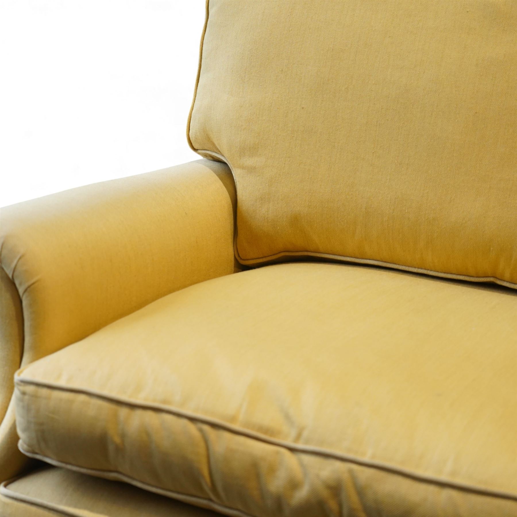 Pair of mid-20th century traditional two seat sofas, loose cushioned seat and back upholstered in pale gold fabric, on turned supports