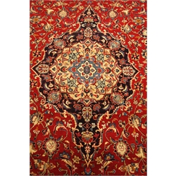  Persian Meshed red ground rug carpet, pointed medallion with rosette, interlaced floral field and spandrels, scrolled guarded border, 393cm x 300cm  