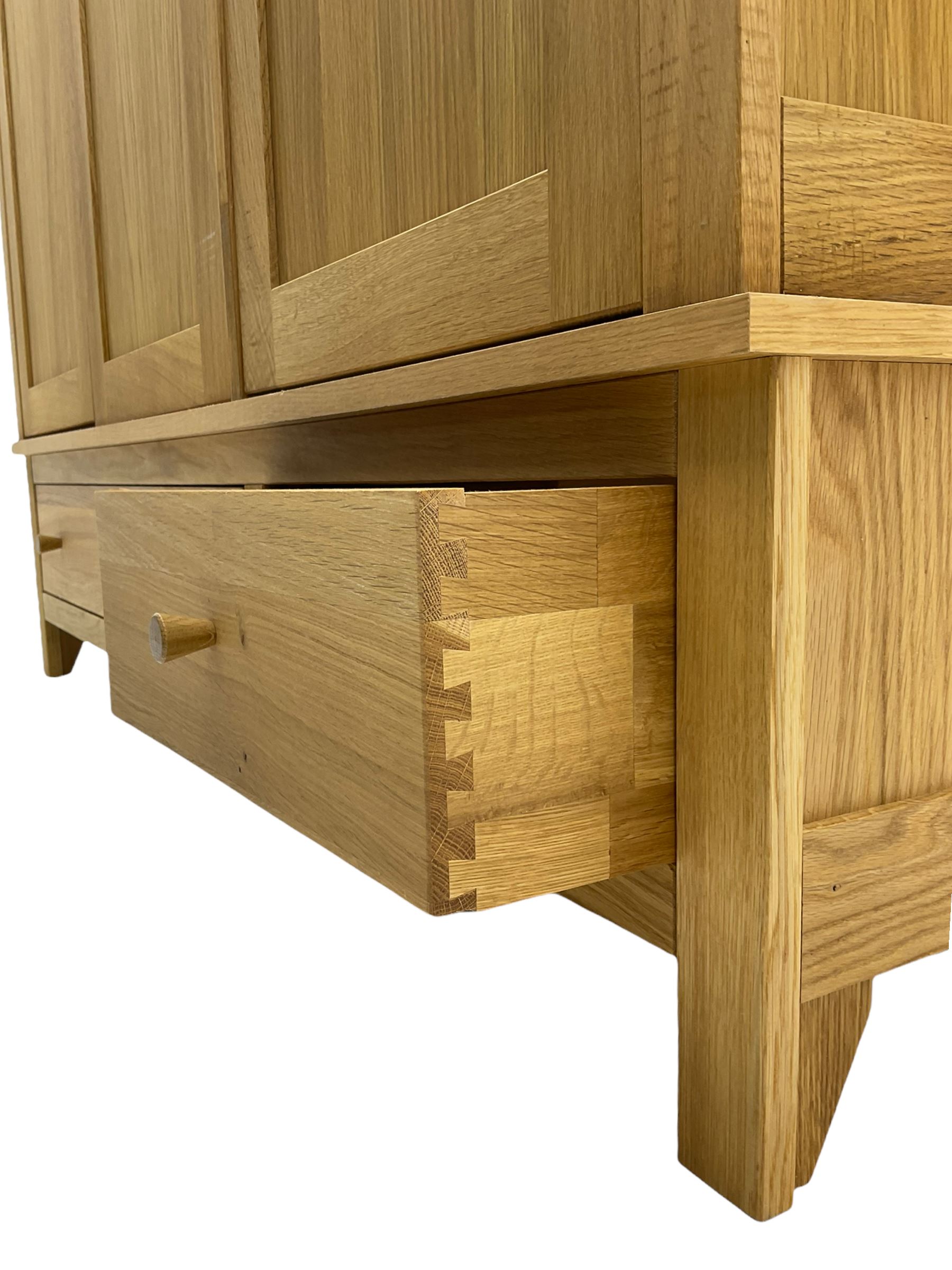 Corndell Furniture - light oak triple wardrobe, enclosed by three panelled doors, one long and one short drawer