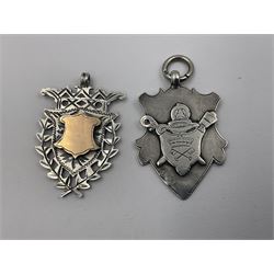 Seven Edwardian and later silver cartouche fobs, to include five gold faced examples and three double sided examples, all hallmarked with various dates and makers
