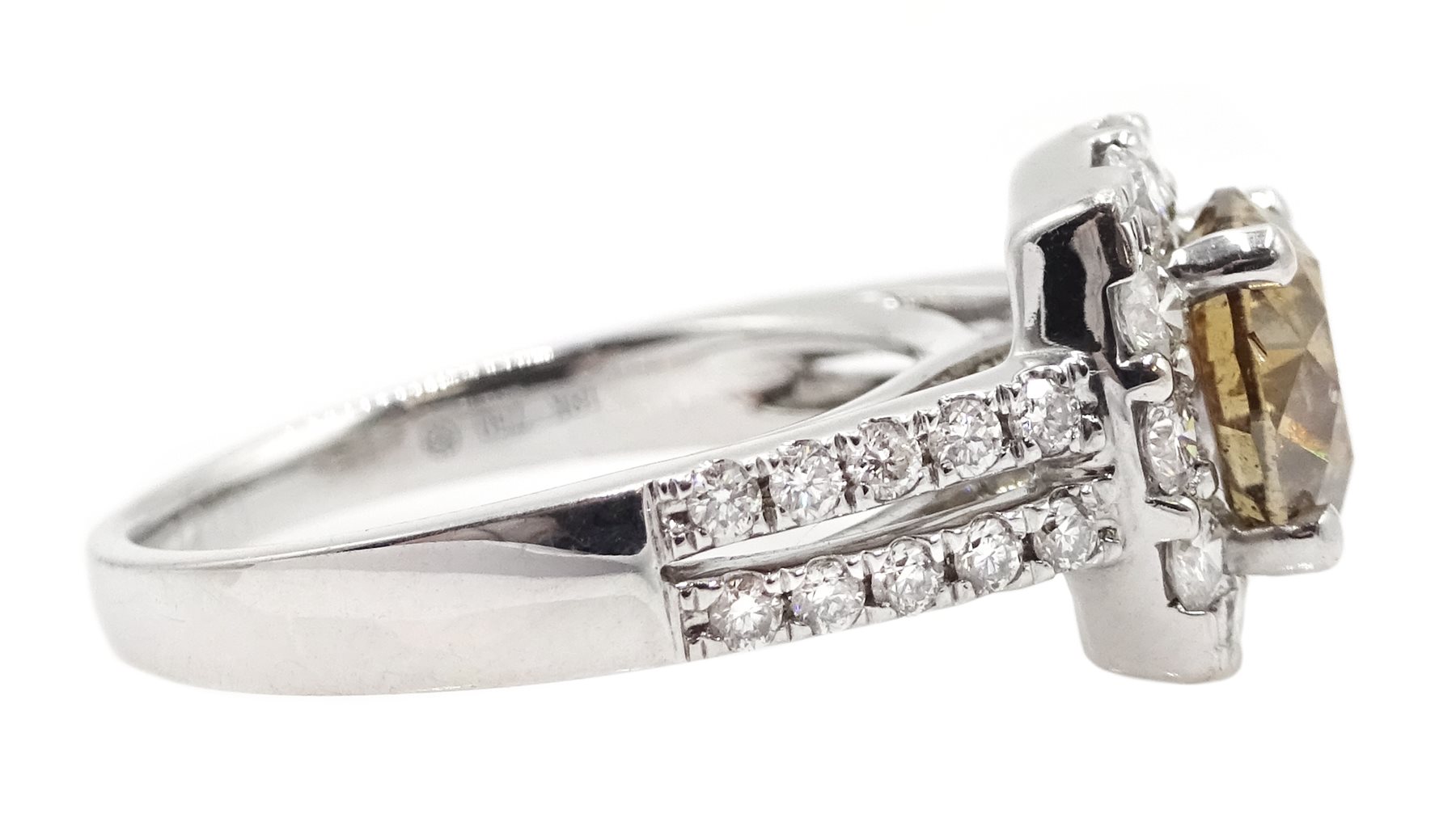 18ct white gold round brilliant cut fancy light brown diamond ring, with halo diamond surround and diamond set shoulders, stamped 750 18K, central diamond 2.00 carat, total white diamond weight 0.90ct