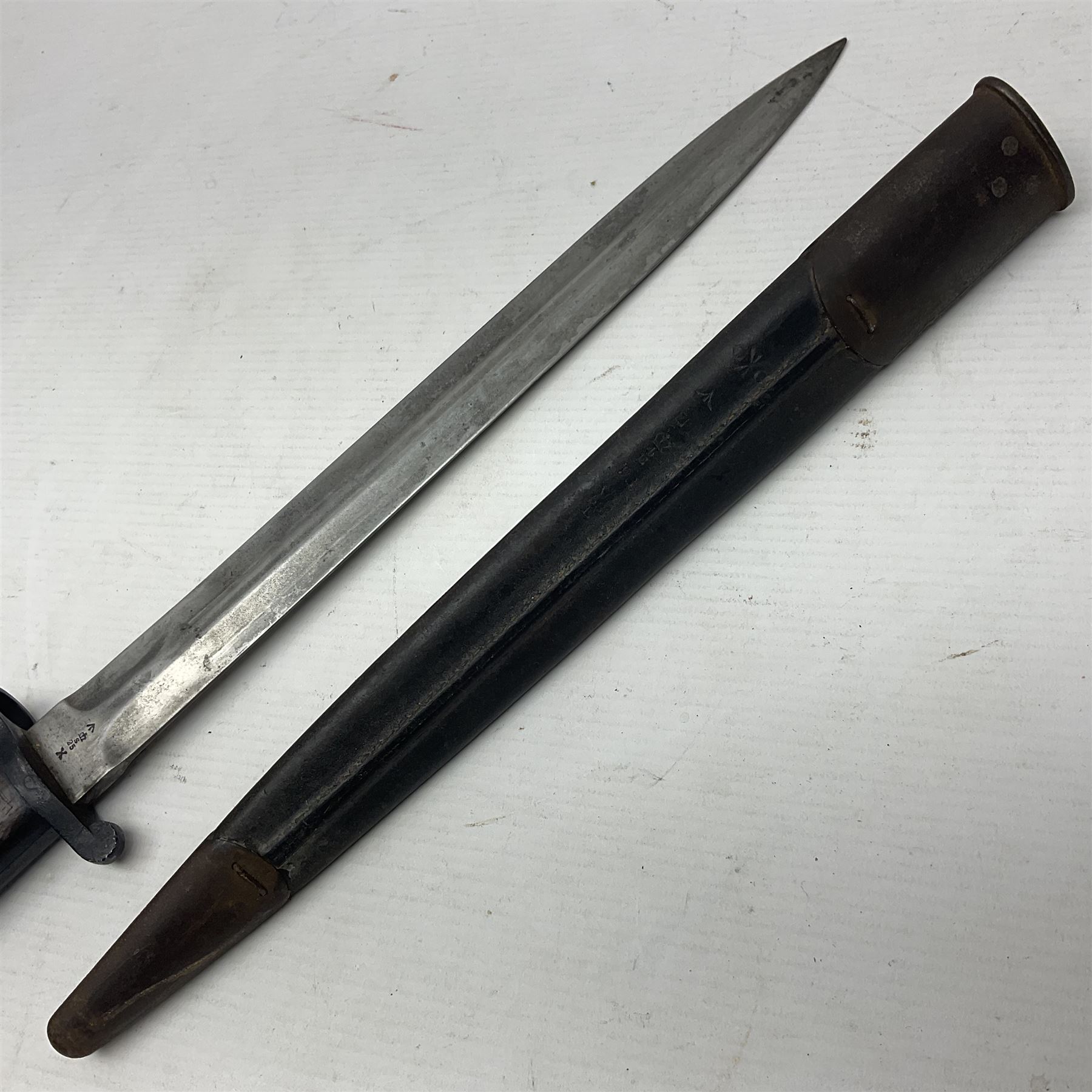 British Pattern 1888 knife bayonet, the 30cm double edged blade by Sanderson with central raised medial ridge and various marks to the ricasso including date code 12 98; in leather covered scabbard with various stamped marks L44cm overall