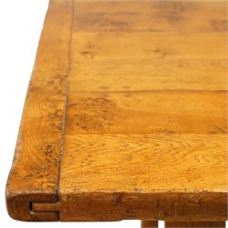 Quality golden figured and burr oak farmhouse refectory dining table, the rectangular plank top with cleated ends, raised on square supports united by arched and H-stretcher trestle base