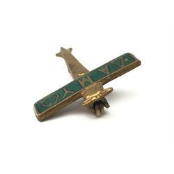  Amy Johnson Souvenir pin badge in the form of a green enamelled aeroplane, the wing inscribed Amy with maps, L2.5cm  