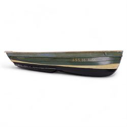 Two wooden fishing coble models, comprising SE31, with rudder, painted in blue, white and red and SSS.33 'Alice', painted in green, black and yellow, largest H16cm, L70cm