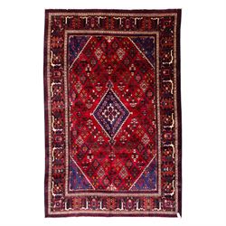 Central Persian Joshagan hand-knotted rug, madder-red field with central stepped lozenge m...