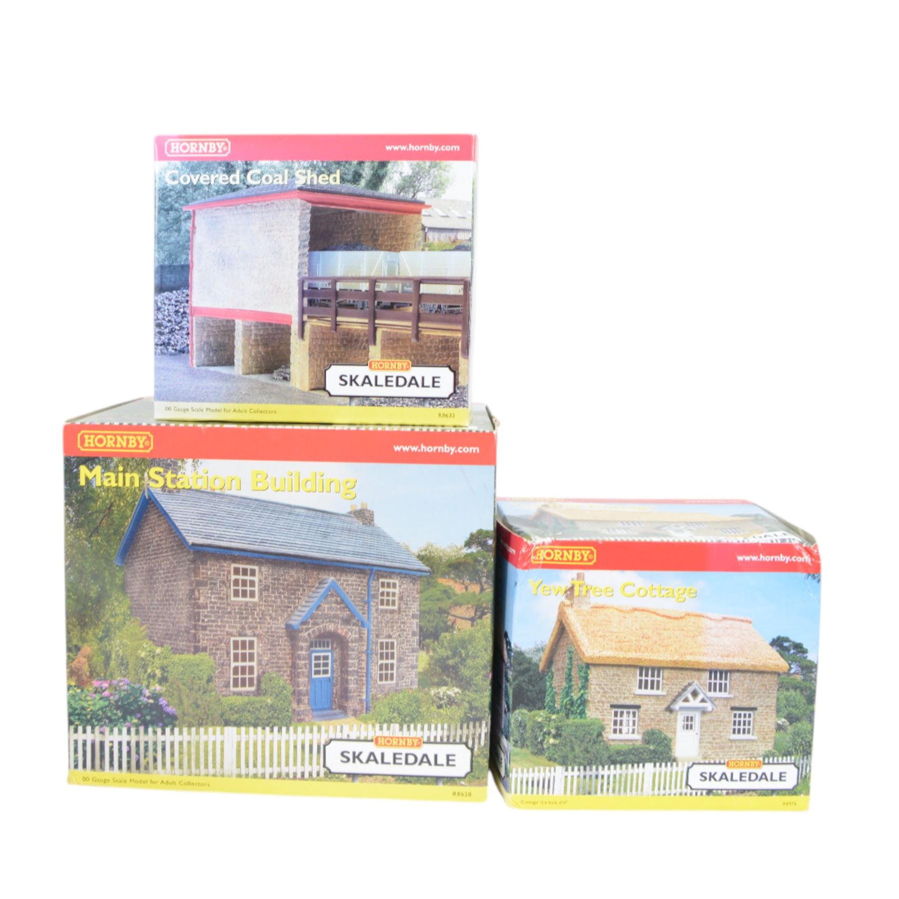 Fourteen Hornby Skaledale 00 gauge model railway trackside buildings, comprising R8718 Lower Skaledale Shelter, R9722 Bay Terrace House, R8635 Goods Shed, R9639 Great Northern Skale Regis Water Tower, R8634 Open Coal Deposit, R8633 Covered Coal Shed, R8628 Main Station Building, R8746 Canal Boat, R8976 Yew Tree Cottage, R8641 Platform Footbridge, R8602 Home Farm Barn, R9634 Great Northern Platform Signal Box, R8700 St Andrews Church and R9635 Great Northern Signal Box, all boxed