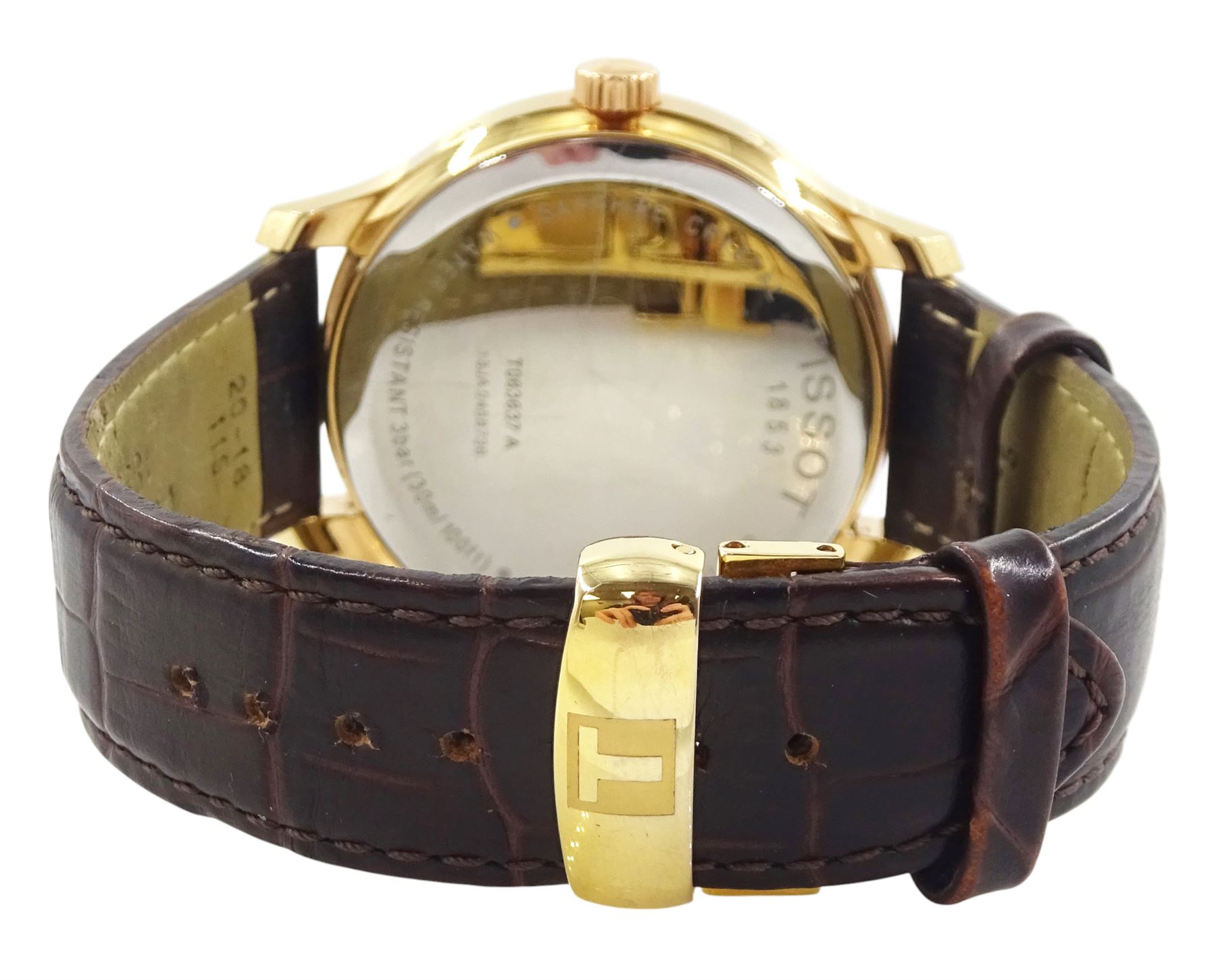 Tissot Tradition Perpetual Calendar gentleman's gold-plated and stainless steel quartz wristwatch. Ref. T063637 A, silvered dial with dagger hour markers and Arabic 12 o'clock, on original brown leather strap, with fold-over clasp, cased and boxed with additional parts