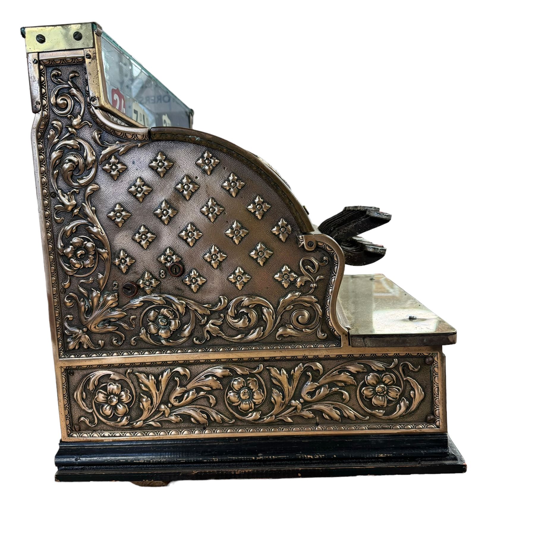 Early 20th century copper and brass till, embossed throughout with relief floral and acanthus leaf decoration, made by The National Cash Register Company Dayton Ohio USA, H46cm