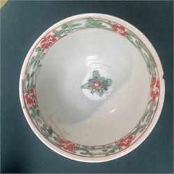 Three Chinese famille verte examples, approximately Yongzheng period, to include two teabowls and two saucers, each decorated with flowers and butterflies, two with sacred fungus mark within double rings, the teabowl with lotus mark, the other indistinct - possibly a Wan mark within lozenge (4)