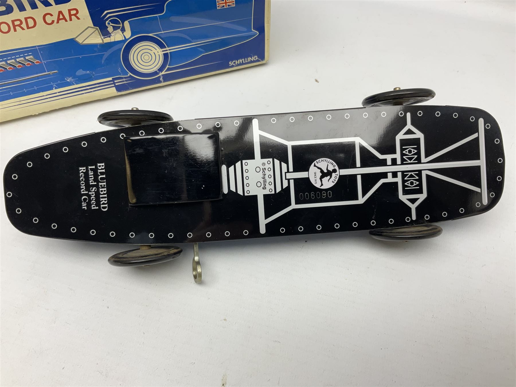 Schylling Collector Series clockwork tin-plate Sir Ian's Bluebird Land Speed Record Car with key and paperwork No.006080; boxed; and clockwork silvered tin-plate model of an 0-6-0 locomotive; unboxed (2)