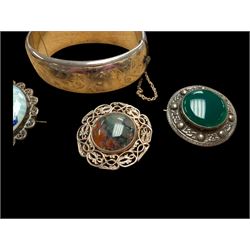 Silver bangle with four silver brooches