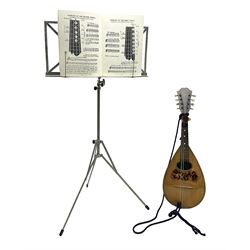  Late 19th/early 20th century Italian lute back mandolin with segmented back and spruce top; bears maker's label for Pietro Tonelli Napoli; together with a mandolin instruction booklet and a folding music stand L60.5cm