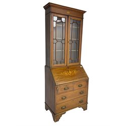 Edwardian inlaid mahogany bureau bookcase, projecting cornice over shell inlaid frieze and two astragal glazed doors, satinwood banding throughout, the fall front inlaid with central urn and extending foliate scrolls, fitted with two short and two long drawers, on bracket feet