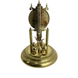 Late-20th century Haller torsion clock - German 400-day clock under an acrylic dome, with a gilt dial Roman numerals and pierced steel hands, on a circular brass plated base with pendulum lock, torsion suspension intact. with key. 