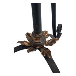 Late 19th century wrought iron and brass pulpit lamp, featuring an adjustable stem with a spiral twist detail, brass foliate mounts, and a tripod base with scrolled feet and decorative floral accents